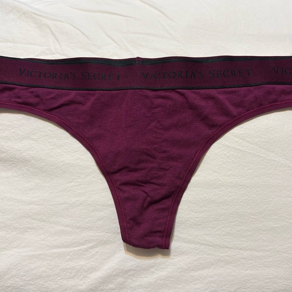 Victoria’s Secret cranberry color cotton logo thong. NWT. Stretchy band. Large.